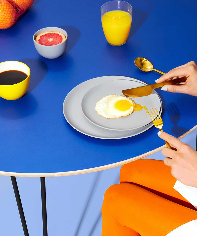 Person Eating with Juice and Coffee Person eating with juice and coffee