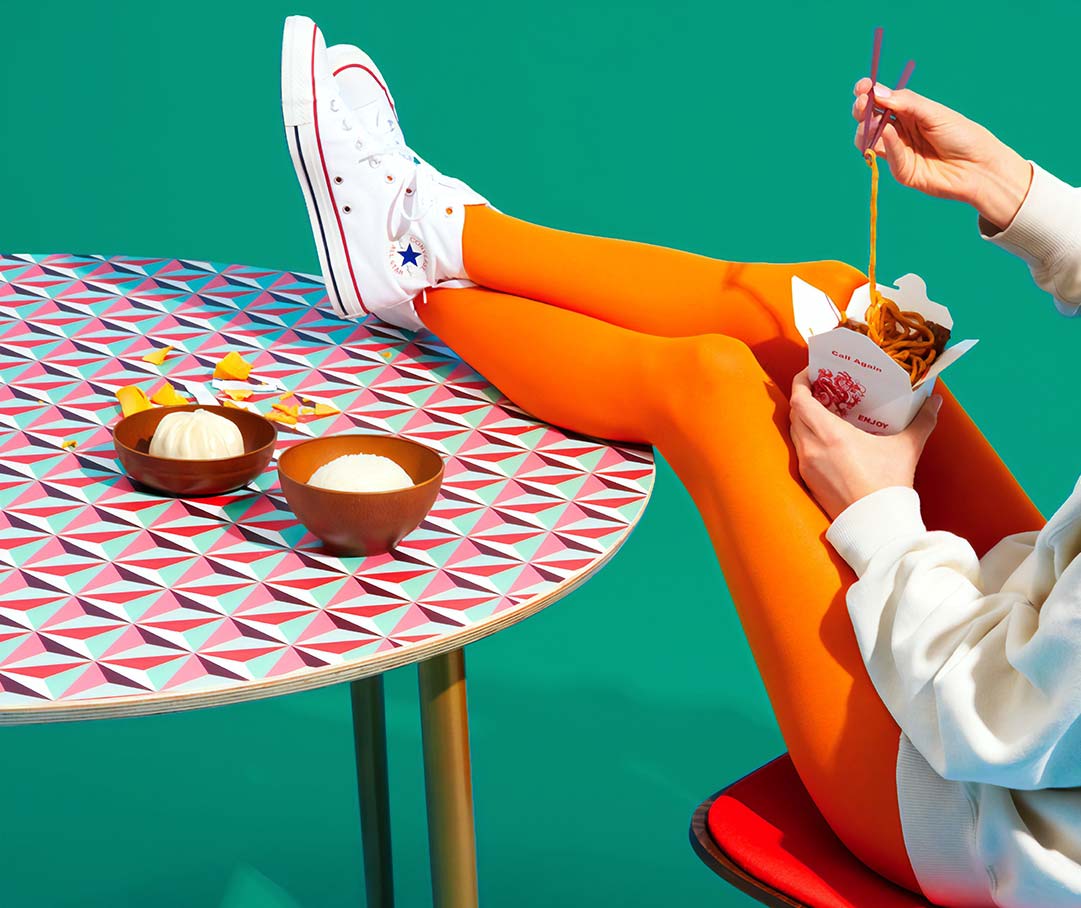 Woman Eating with Feet up on the Table 1 Woman eating with feet up on the table 1