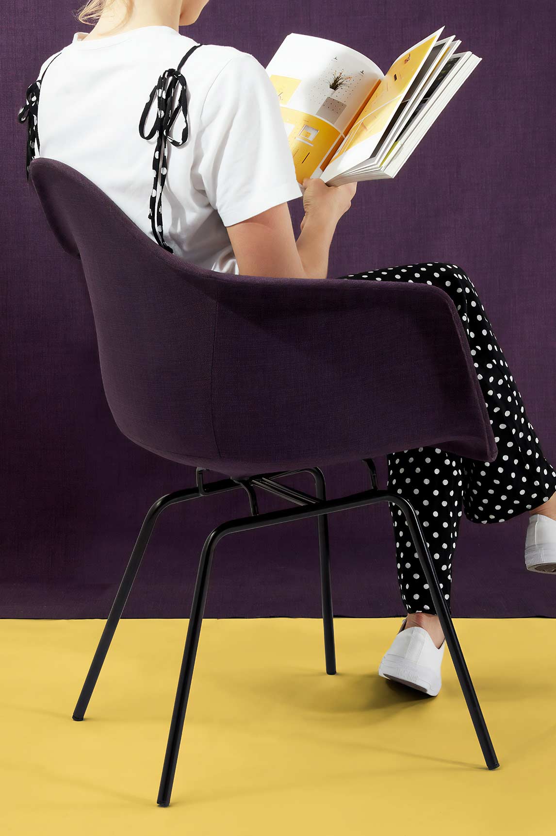 Woman Sitting on a Chair Reading Woman sitting on a chair reading